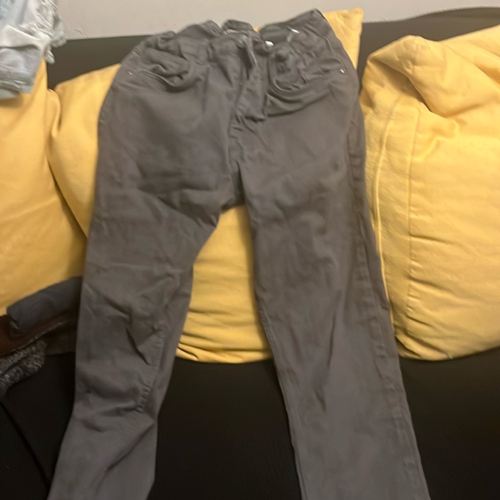 Dark gray pants that are too tight on me.